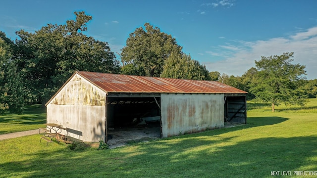 view of outbuilding with a lawn