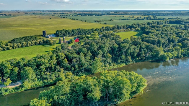 birds eye view of property featuring a water view and a rural view