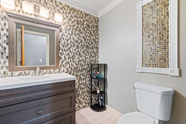 bathroom with crown molding, toilet, tile patterned flooring, and vanity