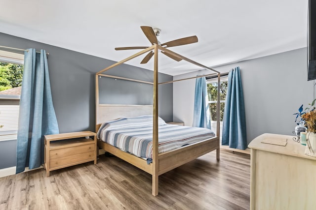 bedroom featuring ceiling fan and hardwood / wood-style floors