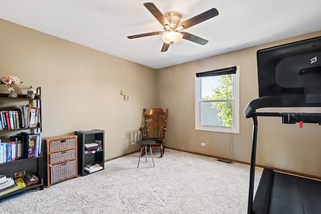 exercise area with ceiling fan and carpet flooring