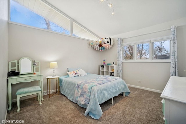 carpeted bedroom with vaulted ceiling