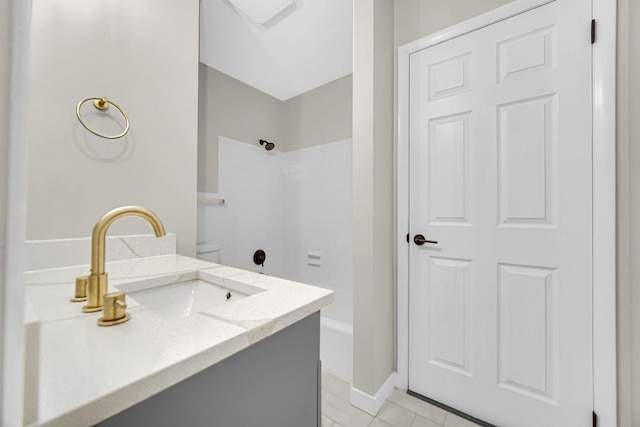 bathroom featuring tile patterned flooring, vanity, and shower / tub combination