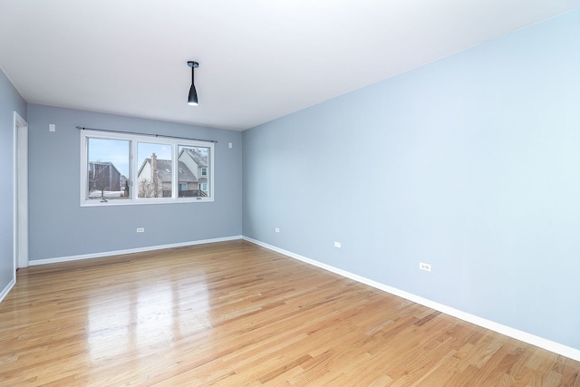 unfurnished room with light hardwood / wood-style floors