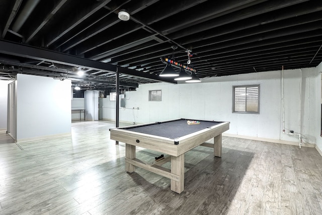 game room featuring hardwood / wood-style flooring, electric panel, and pool table