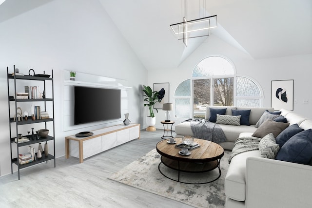 living room featuring light hardwood / wood-style floors and vaulted ceiling