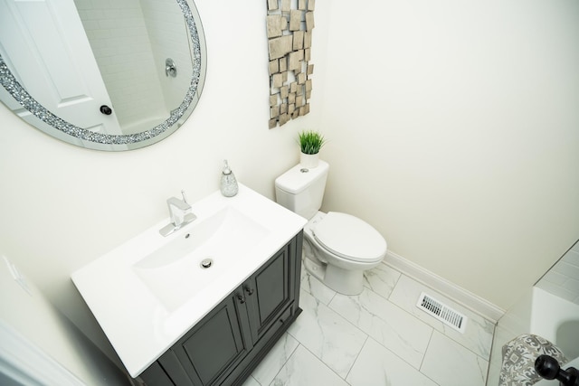 bathroom with vanity and toilet