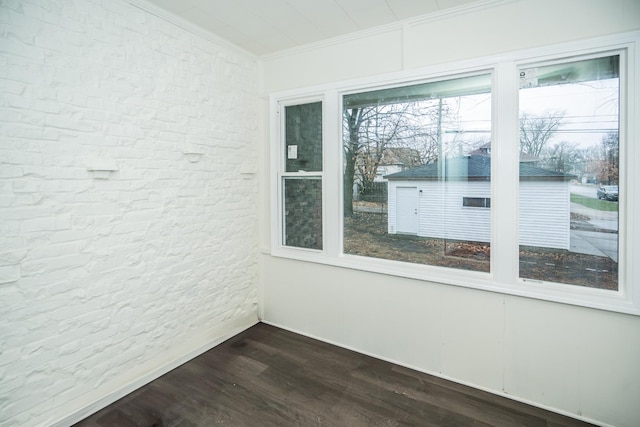 unfurnished room featuring ornamental molding and hardwood / wood-style floors