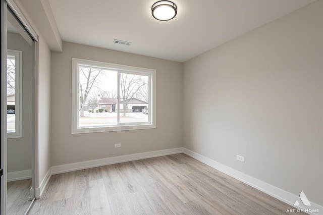 spare room with light hardwood / wood-style floors