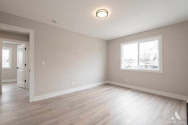 spare room with light wood-type flooring