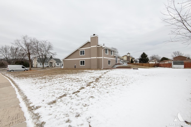 view of snow covered property