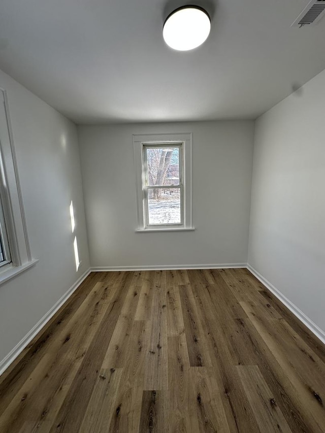 empty room featuring wood-type flooring