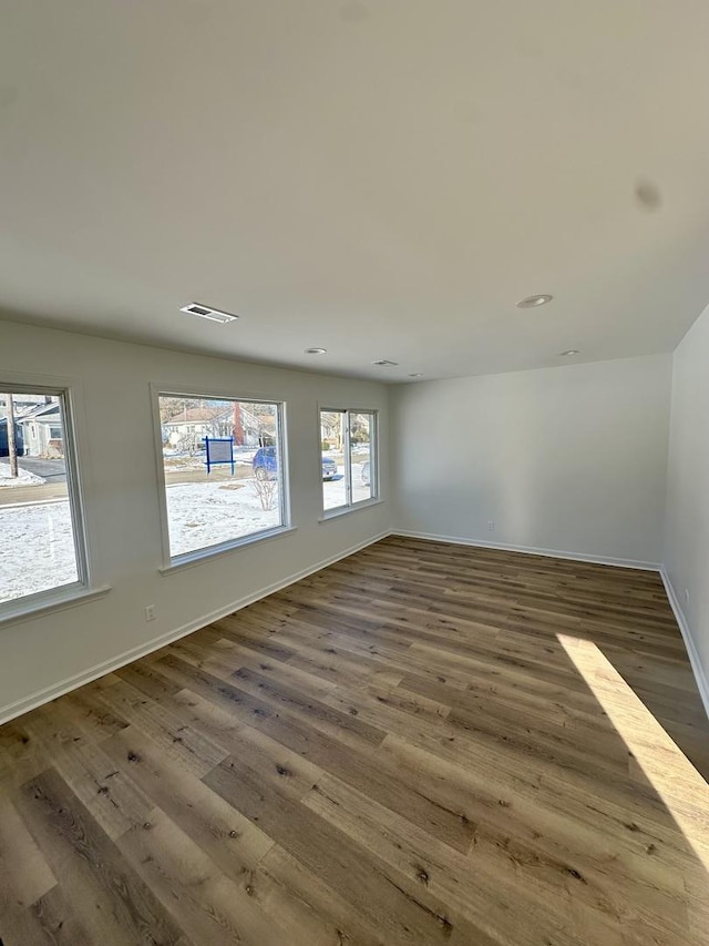 spare room featuring dark hardwood / wood-style flooring