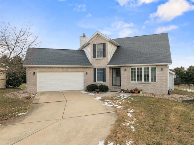 view of front of house with a garage and a front yard