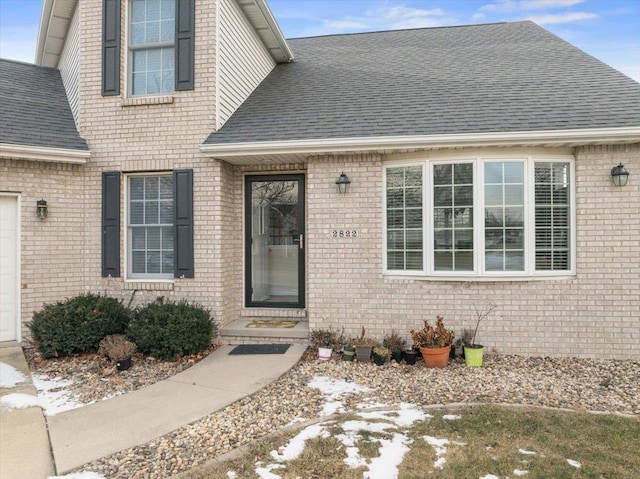 view of exterior entry featuring a garage