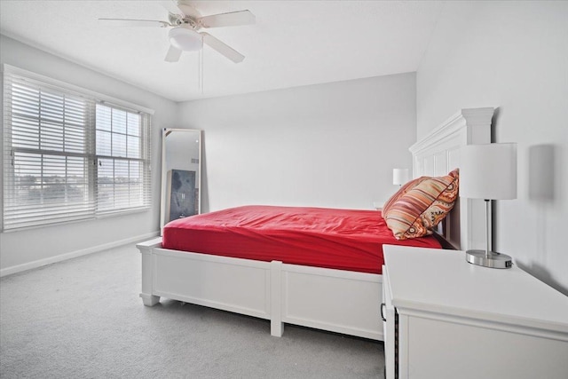 bedroom featuring ceiling fan and carpet