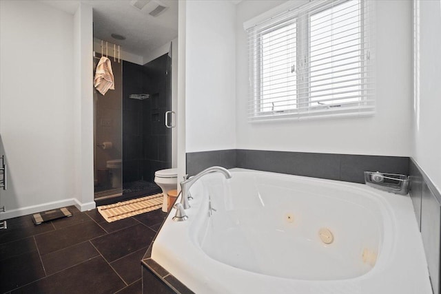 bathroom featuring tile patterned flooring, plus walk in shower, and toilet