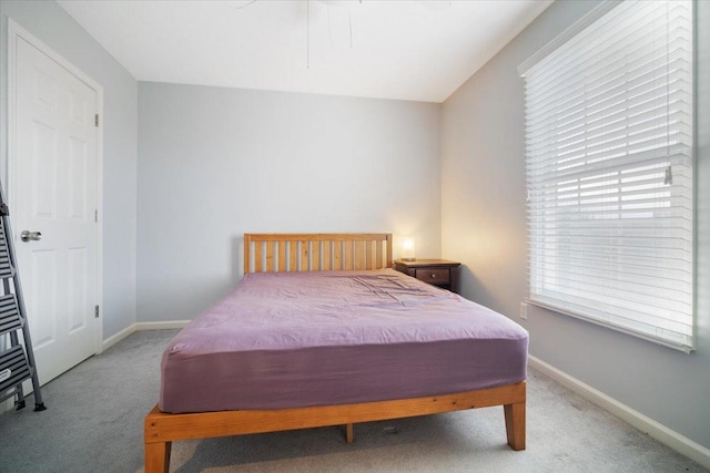 bedroom featuring light colored carpet