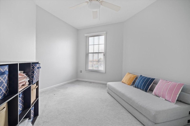 sitting room featuring ceiling fan and carpet