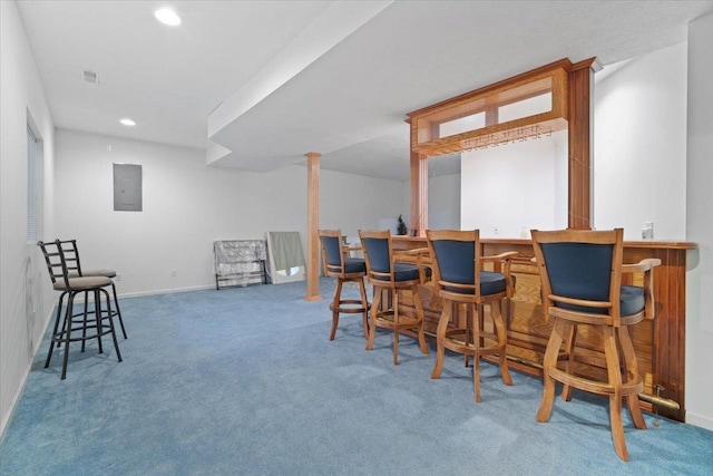 living area with bar, carpet floors, and electric panel