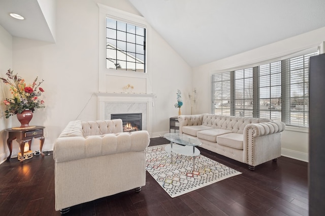 living room featuring lofted ceiling and dark hardwood / wood-style floors