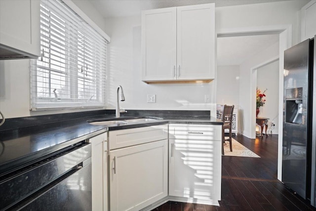 kitchen featuring white cabinetry, dishwasher, sink, and stainless steel fridge with ice dispenser