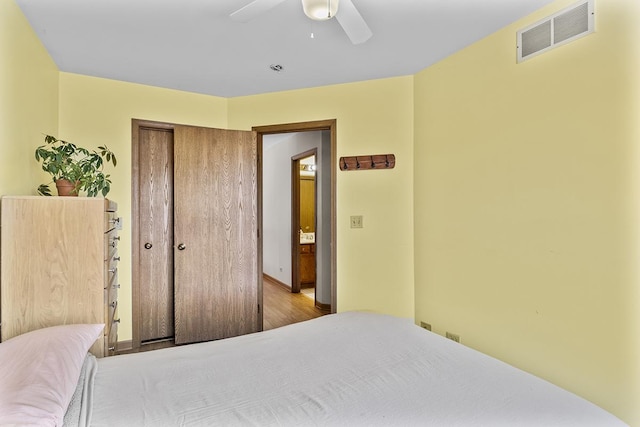 bedroom featuring ceiling fan and a closet