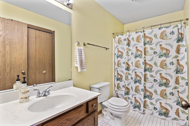 bathroom featuring tile patterned floors, toilet, curtained shower, and vanity