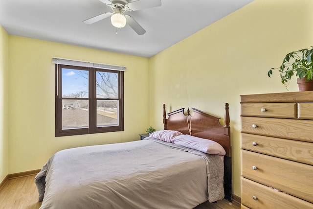 bedroom featuring ceiling fan and hardwood / wood-style floors