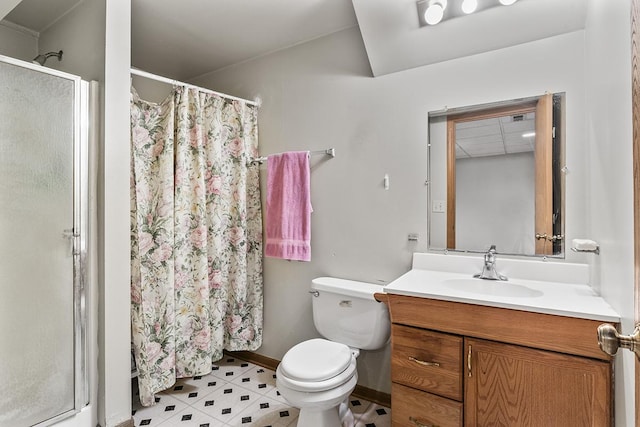 bathroom with a paneled ceiling, vanity, toilet, and a shower