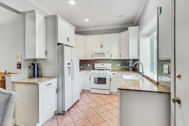 4332 N Kenmore Ave, Chicago, IL 60613 - kitchen with sink, white appliances, ornamental molding, and white cabinets
