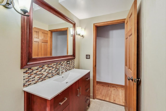 4332 N Kenmore Ave, Chicago, IL 60613 - bathroom featuring vanity, tile patterned flooring, and backsplash