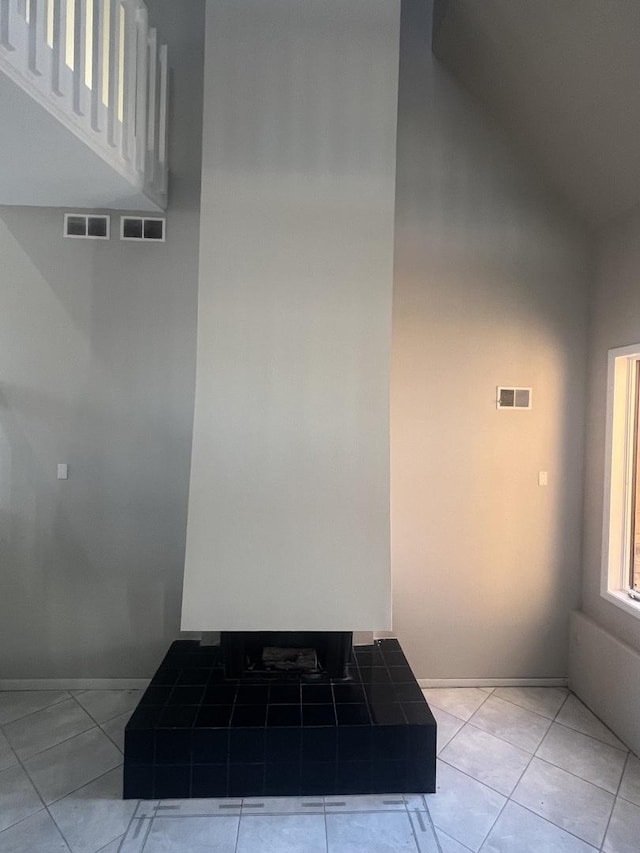 bathroom with tile patterned flooring and lofted ceiling