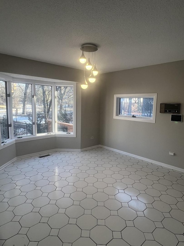 empty room with a textured ceiling