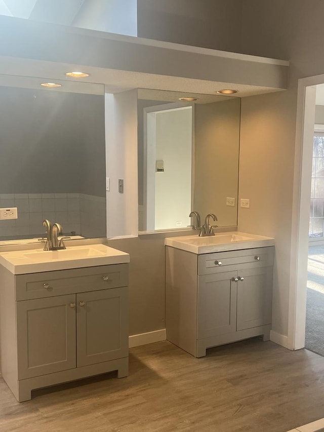 bathroom with wood-type flooring and vanity