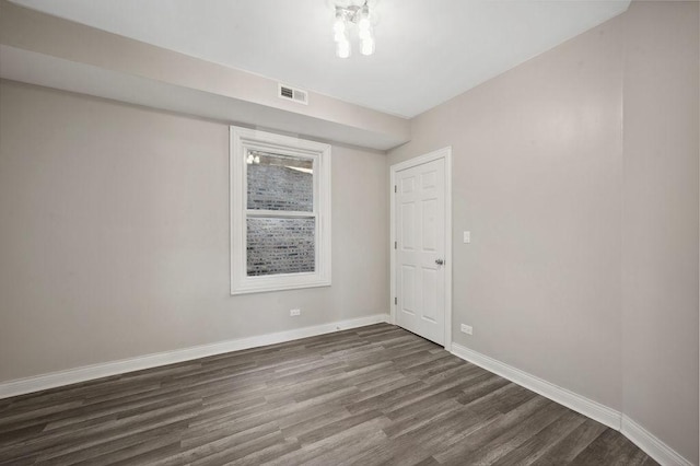 unfurnished room featuring dark hardwood / wood-style floors