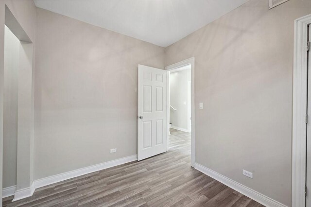 spare room with light wood-type flooring