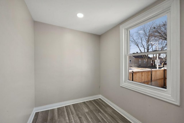 spare room featuring wood-type flooring