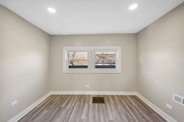 empty room featuring wood-type flooring