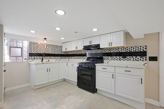 kitchen featuring sink, white cabinets, gas stove, and tasteful backsplash