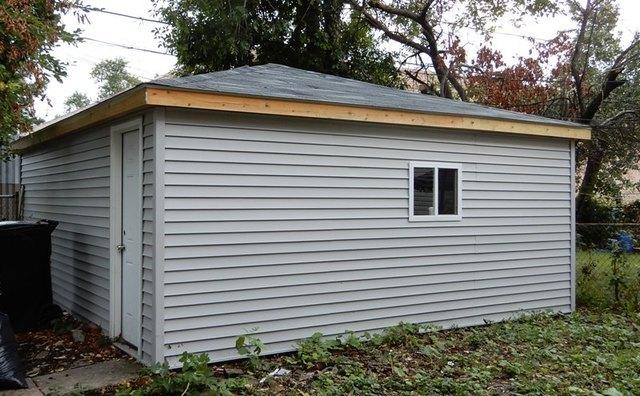 view of property exterior with a storage shed