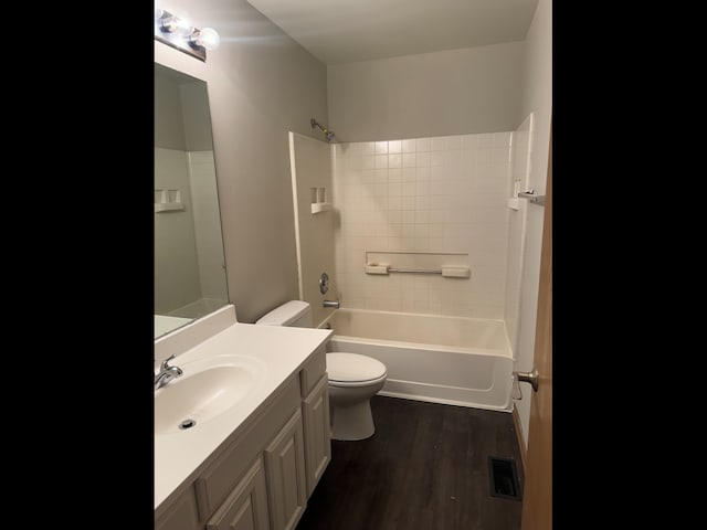 1009 Symphony Dr, Aurora, IL 60504 - bathroom with toilet, vanity, bathing tub / shower combination, and wood finished floors