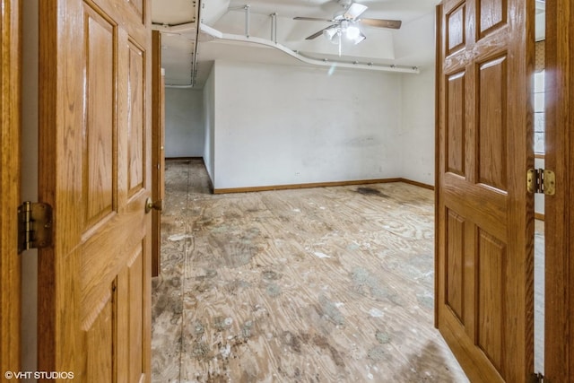 foyer entrance featuring wood-type flooring and ceiling fan