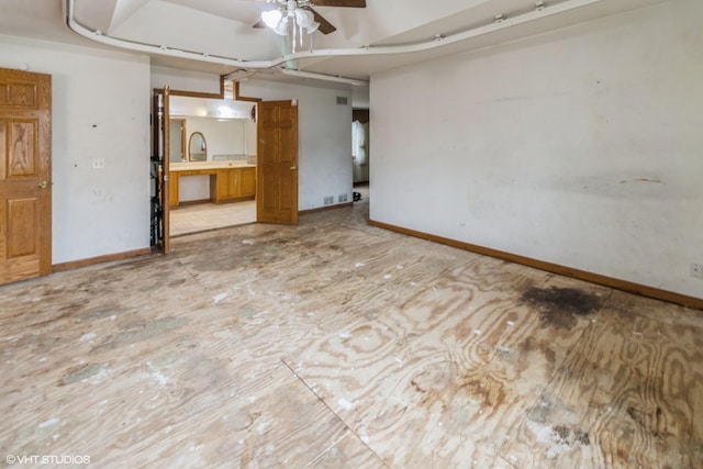 unfurnished room featuring ceiling fan