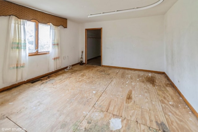 unfurnished room featuring hardwood / wood-style flooring