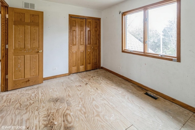 unfurnished bedroom featuring a closet