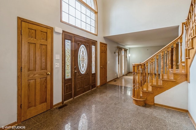 entryway with a high ceiling