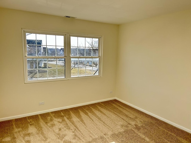 unfurnished room featuring carpet floors