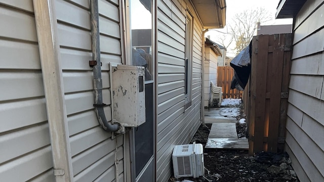 view of side of property with ac unit