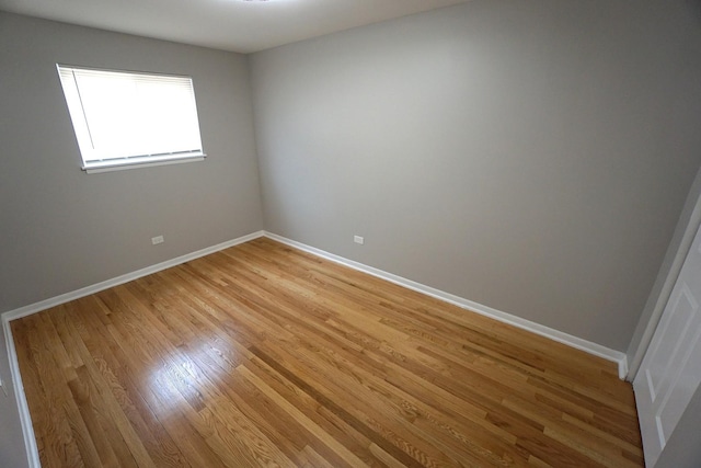 spare room with light wood-type flooring